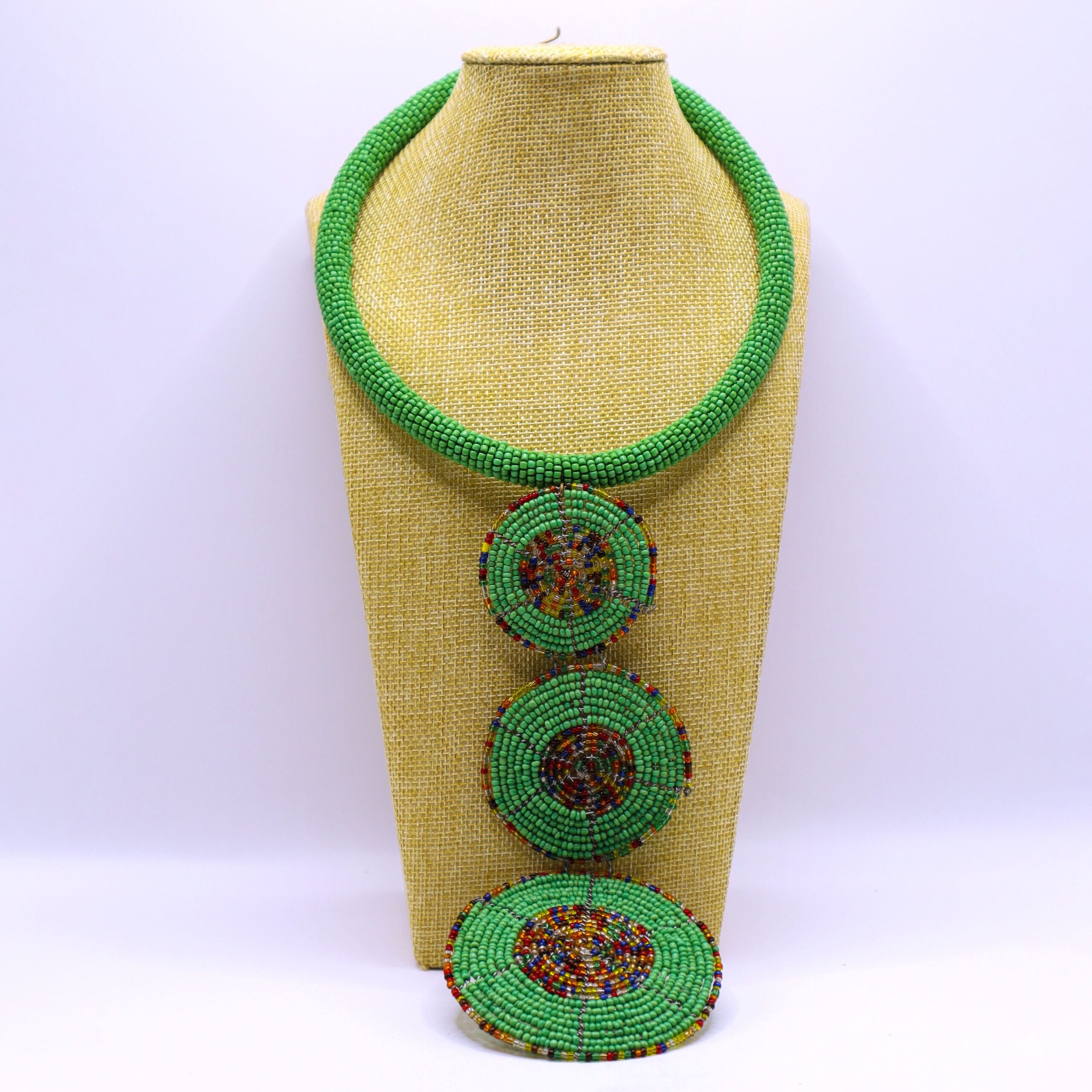 Second image of African inspired beaded triple pendant necklace.